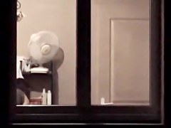 The window of my neighbor is opened showing her nude boobs
