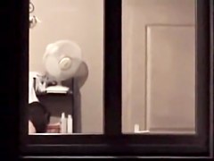 The window of my neighbor is opened showing her nude boobs