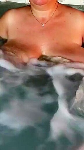 Tit play in hot tub