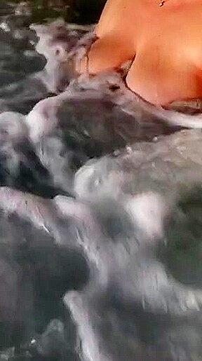 Tit play in hot tub