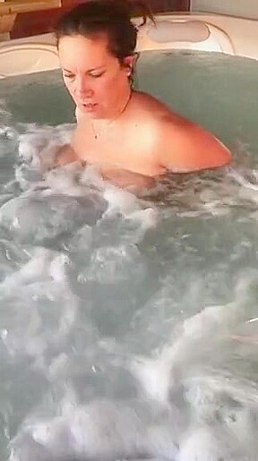 Tit play in hot tub