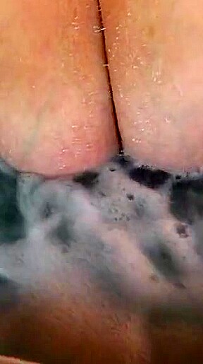 Tit play in hot tub