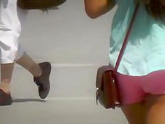 Tourist girl with hot ass in pink shorts