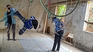 Two Girls Suspended In An Abandoned House