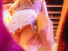 Upskirt inside a jeans miniskirt while walking