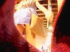 Upskirt inside a jeans miniskirt while walking