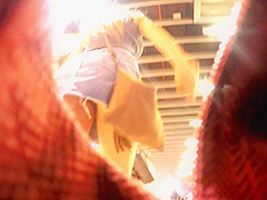 Upskirt inside a jeans miniskirt while walking