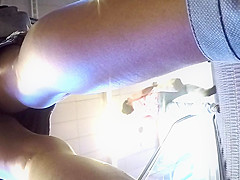 Upskirt of a beauty in jeans miniskirt