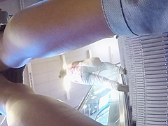 Upskirt of a beauty in jeans miniskirt
