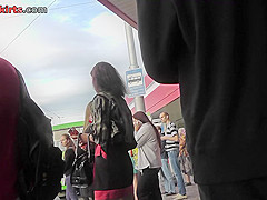 Upskirt porn with brunette-hair gal in a public place