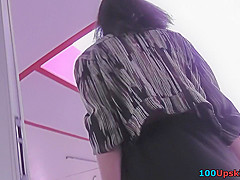 Upskirt porn with brunette-hair gal in a public place