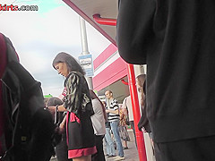Upskirt porn with brunette-hair gal in a public place