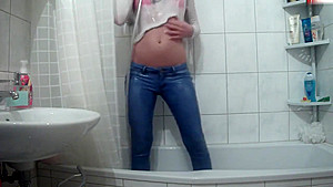 Wetlook pissing and showering jeans