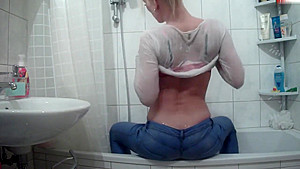 Wetlook pissing and showering jeans