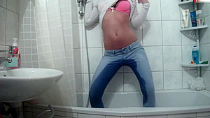 Wetlook pissing and showering jeans