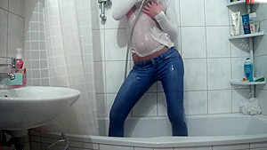 Wetlook pissing and showering jeans