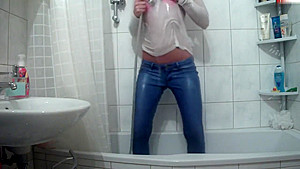 Wetlook pissing and showering jeans