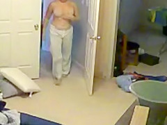 Wife undressing in the bedroom