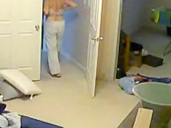 Wife undressing in the bedroom