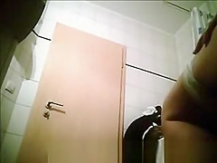 Woman doing her hygiene in bathroom