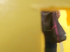 Woman pees and cleans hairy pussy