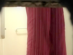 Woman showers with a luffa