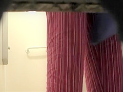 Woman showers with a luffa