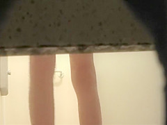 Woman showers with a luffa