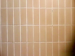 Woman takes a pee in public toilet