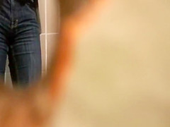 Woman takes a pee in public toilet
