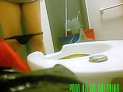 Women caught pissing in public toilet