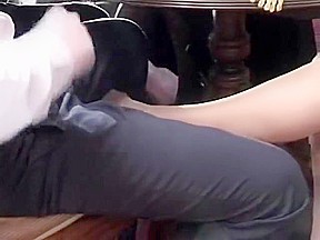 footjob under table tease