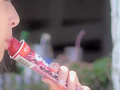teen 18+ girl sucks on an ice cone