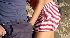 the most beautiful girl in the world blows on the beach