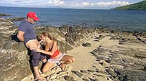 the most beautiful girl in the world blows on the beach