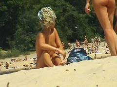 two red hot birds on the beach one playing with her lovely titties