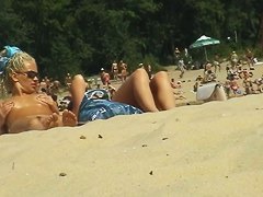 two red hot birds on the beach one playing with her lovely titties